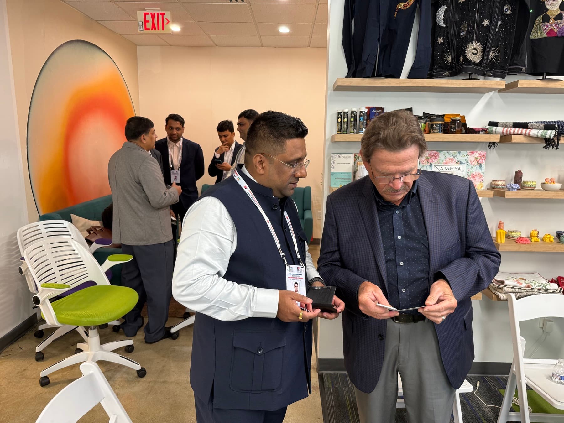 A buyer examining a product during a conversation at USICC