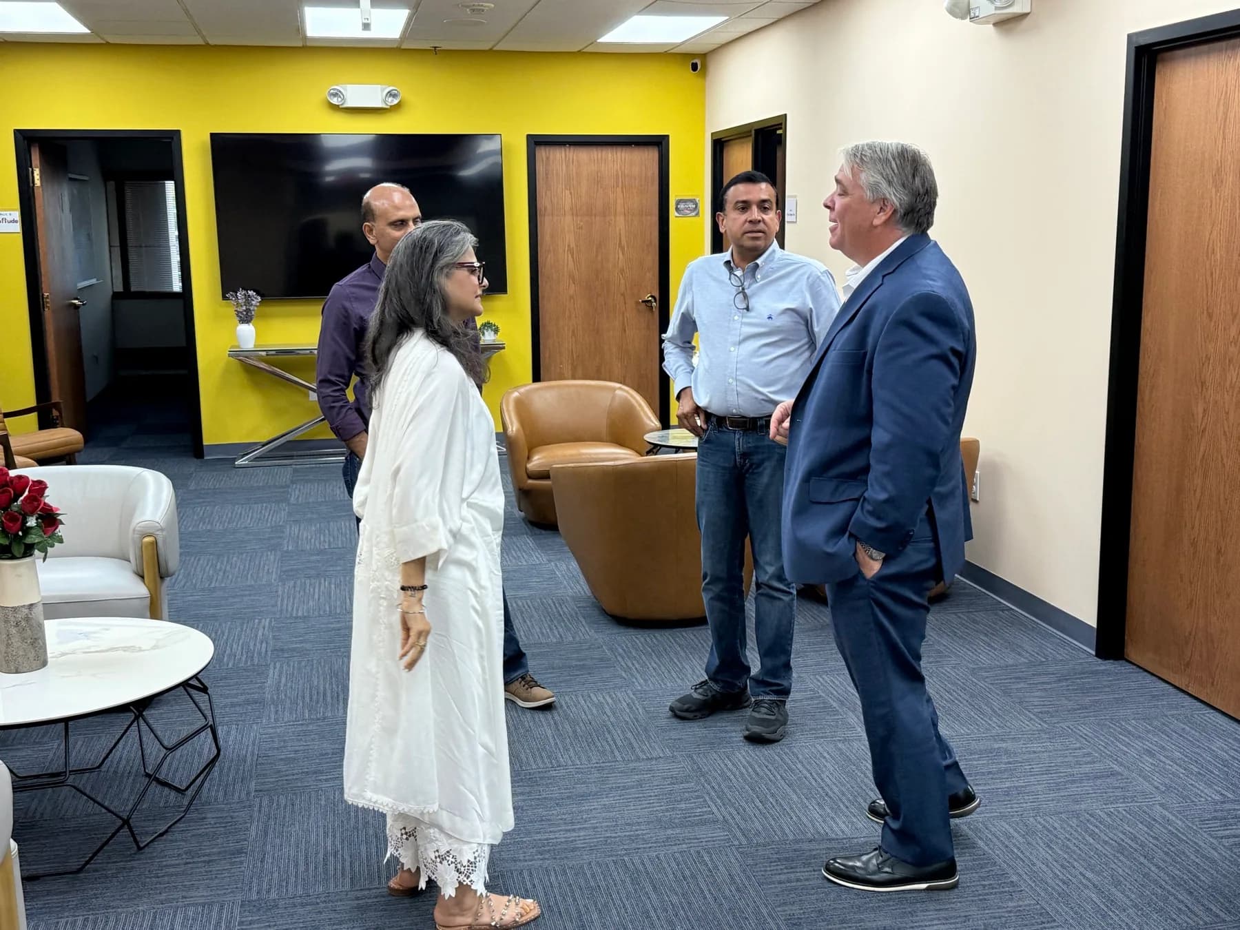 Business visitors talking together inside the USICC lounge