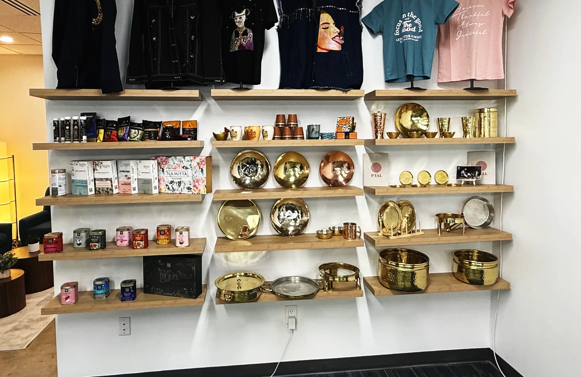Shelves of packaged food, brass and textiles